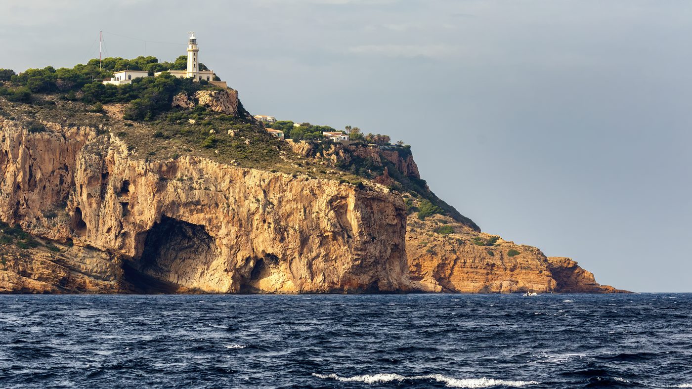 Cap de la Nau cliffs at Javea, which hide the Cova dels Orguens sea cave at their base