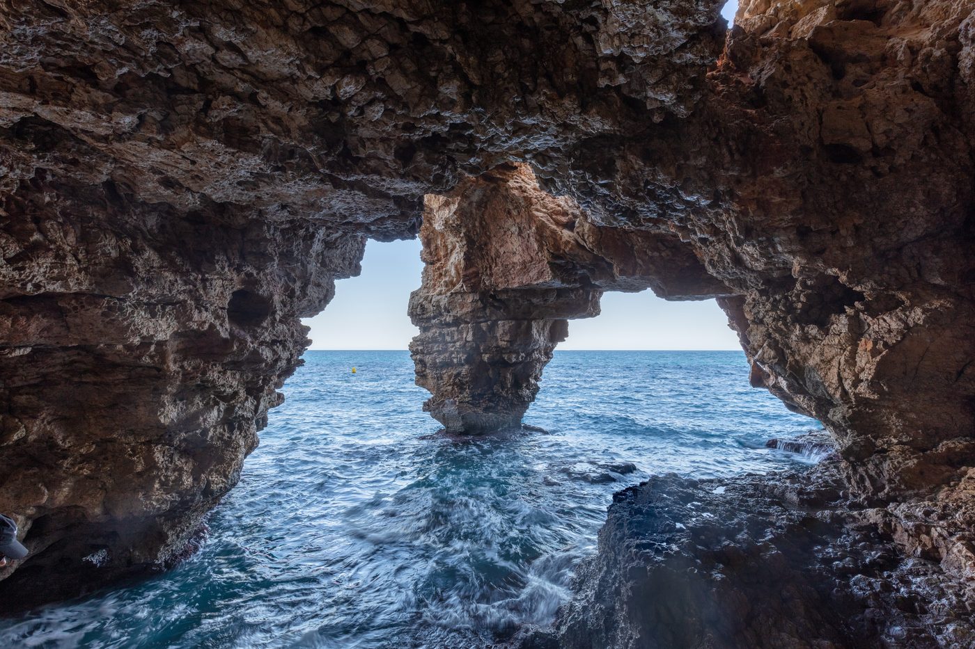 Els Arcs natural rock arches of the Cova dels Arcs at Cala Moraig, Benitatxell